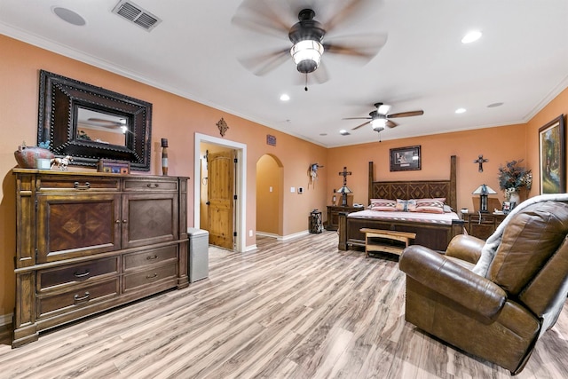 bedroom featuring light hardwood / wood-style flooring, ornamental molding, and ceiling fan