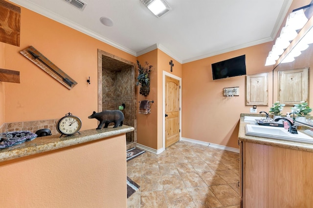 interior space with crown molding and vanity