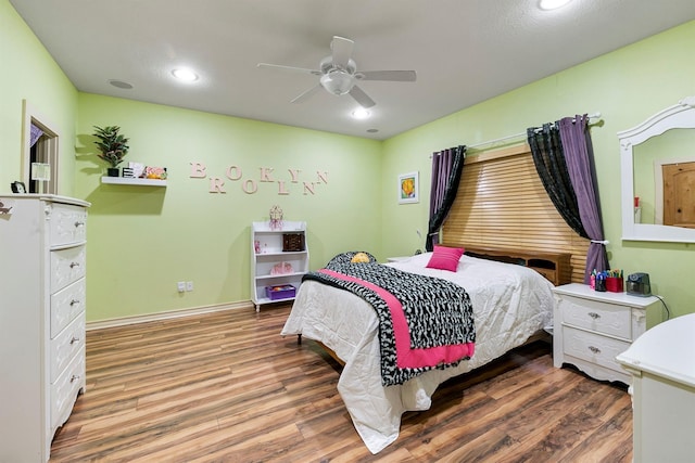 bedroom featuring wood-type flooring and ceiling fan