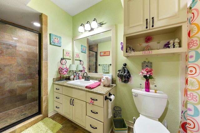 bathroom with walk in shower, vanity, and toilet