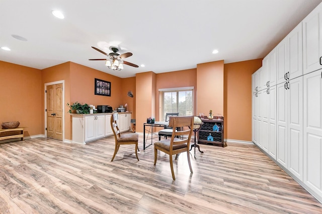 dining area featuring ceiling fan and light wood-type flooring