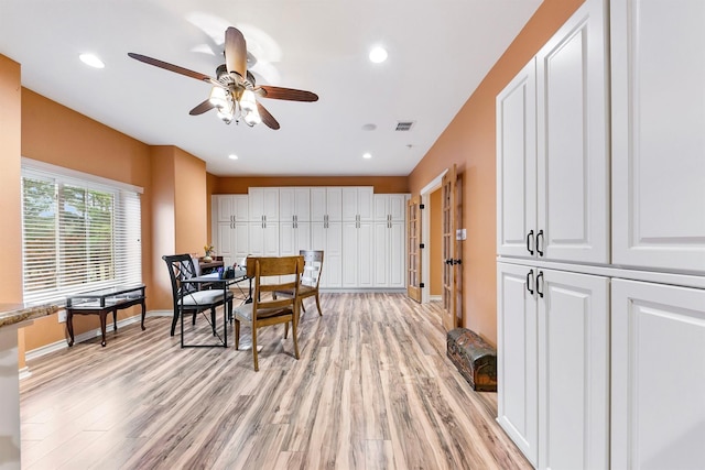 dining room featuring light hardwood / wood-style flooring and ceiling fan