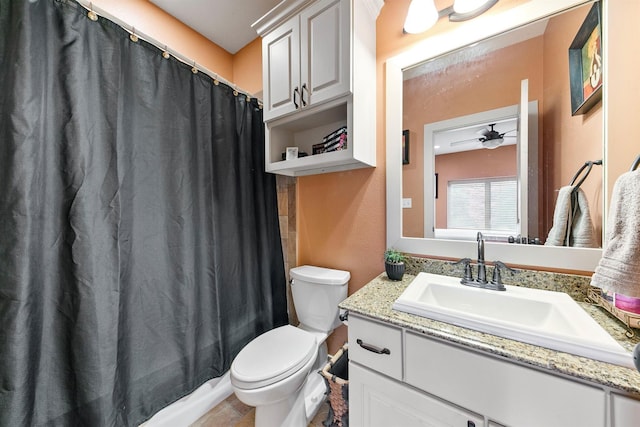 bathroom with vanity, ceiling fan, and toilet