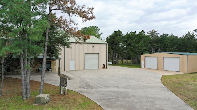 garage with a lawn