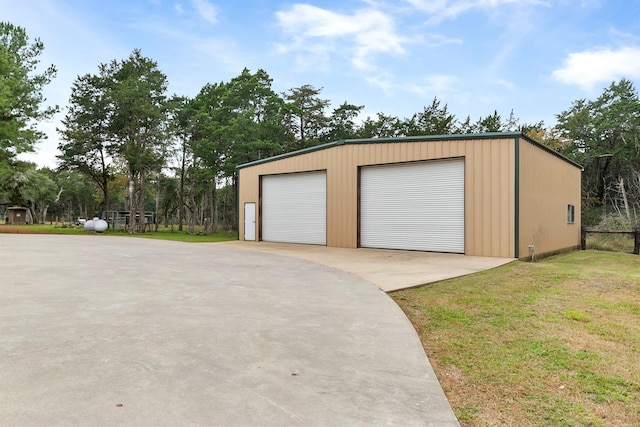 garage featuring a yard