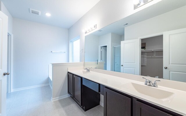 13301 Villa Sola Dr, La Marque, TX 77568 - bathroom with tile patterned floors, an enclosed shower, and vanity