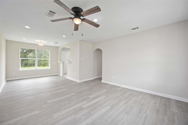 empty room featuring ceiling fan and light wood-type flooring