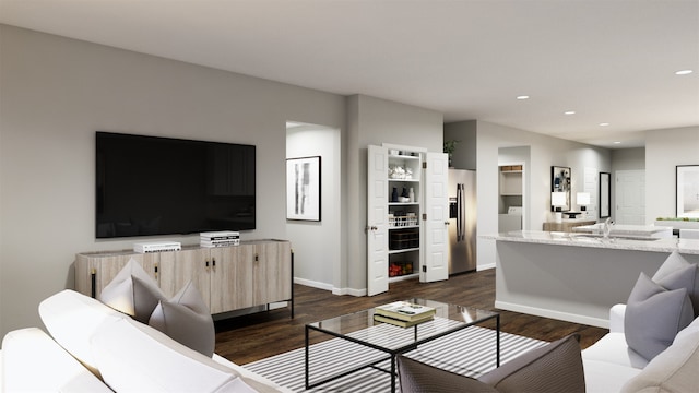 living room featuring dark hardwood / wood-style flooring and washer / dryer