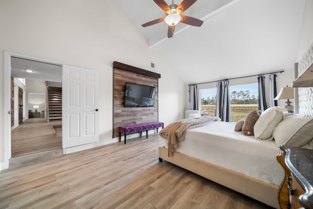 bedroom with beam ceiling, ceiling fan, high vaulted ceiling, and light wood-type flooring