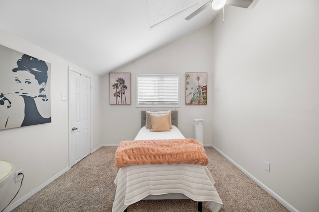 bedroom featuring vaulted ceiling, carpet flooring, and ceiling fan