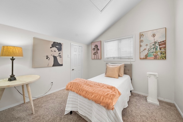 bedroom with light colored carpet and vaulted ceiling