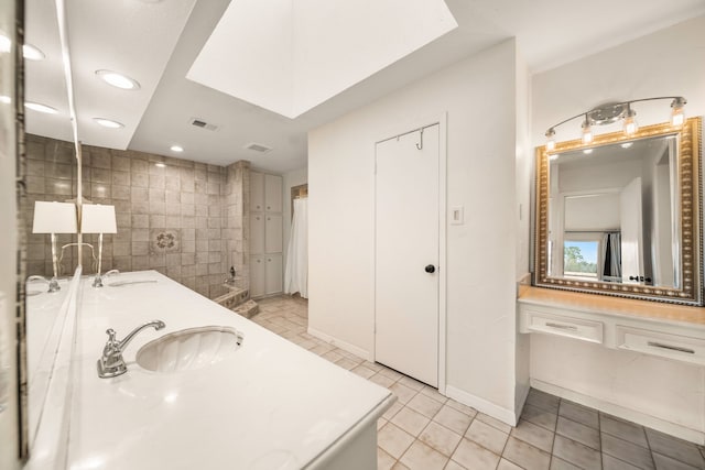 bathroom with vanity and tile patterned flooring