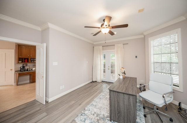 home office featuring french doors, ceiling fan, ornamental molding, and light hardwood / wood-style floors