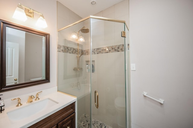 bathroom with vanity and an enclosed shower