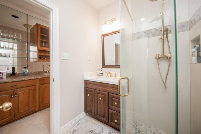 bathroom featuring vanity, tile patterned flooring, and walk in shower