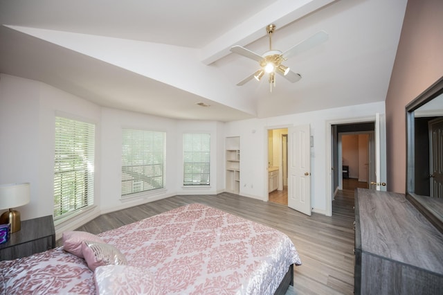 bedroom with ceiling fan, wood-type flooring, and lofted ceiling with beams