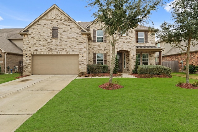 view of front facade featuring a garage and a front lawn