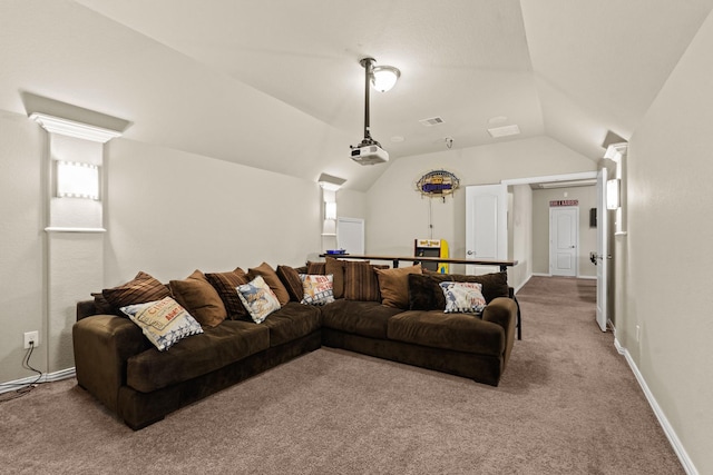 carpeted cinema room featuring vaulted ceiling