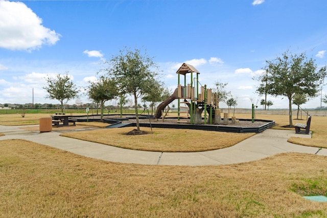 view of playground featuring a lawn