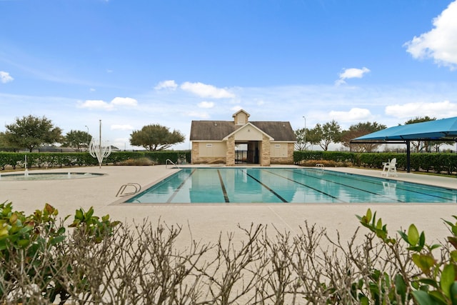 view of swimming pool featuring a patio