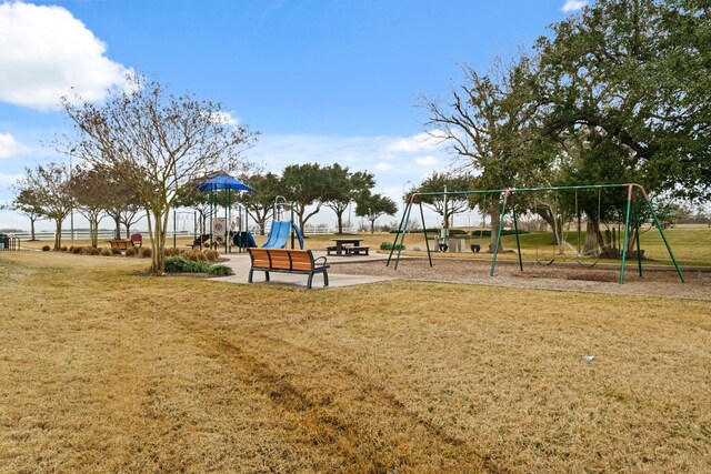 view of jungle gym with a lawn