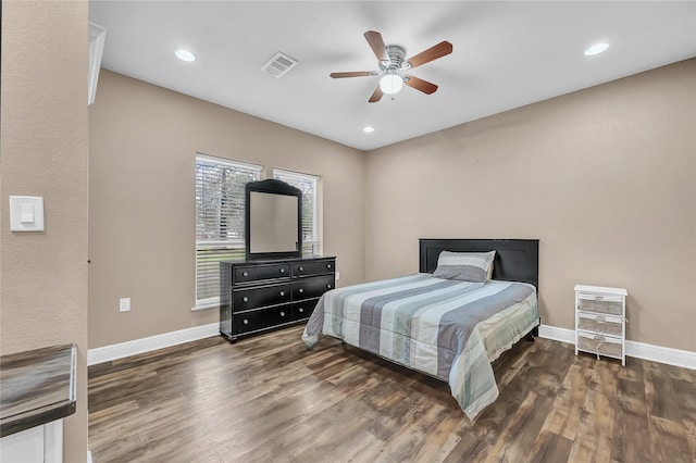 bedroom with dark wood-type flooring and ceiling fan