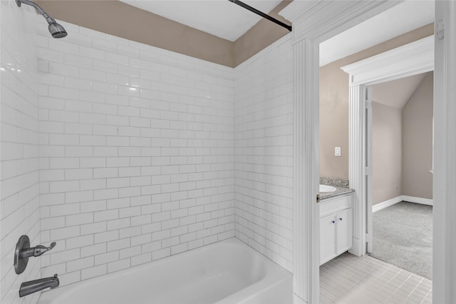 bathroom with vanity and tiled shower / bath combo