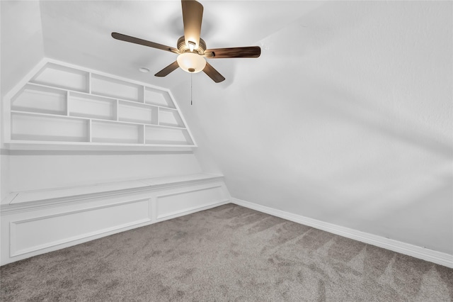 interior space featuring carpet and ceiling fan