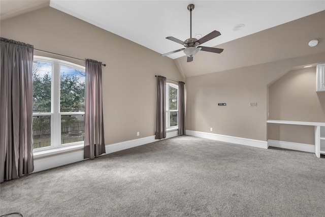 interior space featuring ceiling fan and vaulted ceiling