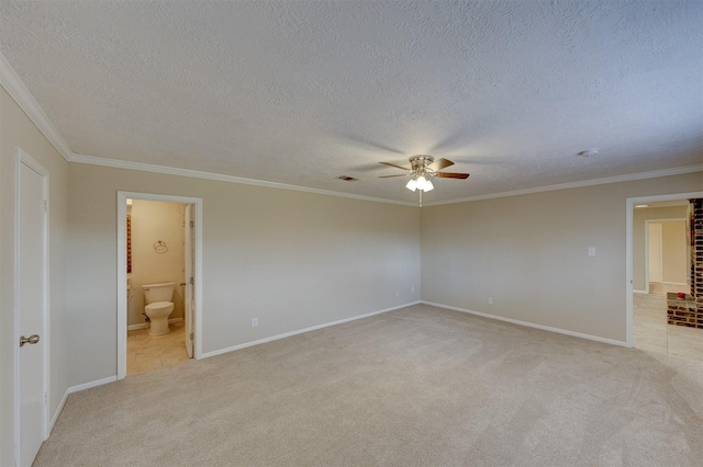 carpeted spare room with crown molding, a textured ceiling, and ceiling fan