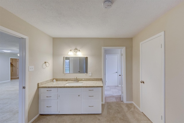 bathroom featuring vanity and a textured ceiling