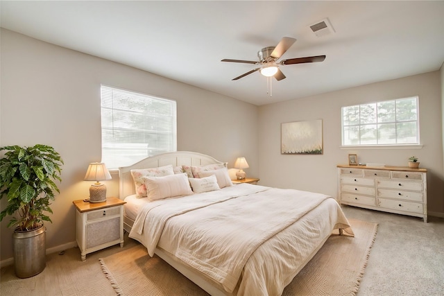 bedroom with light carpet and ceiling fan