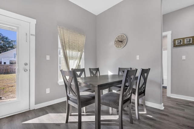 dining room with dark hardwood / wood-style flooring