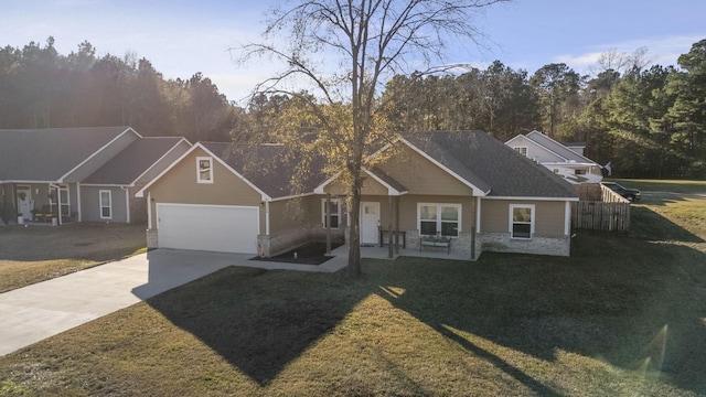 view of front of property with a garage and a front yard