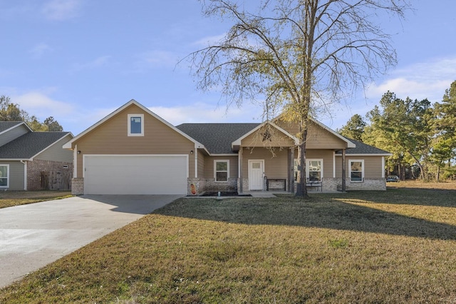 view of front of home with a garage and a front yard