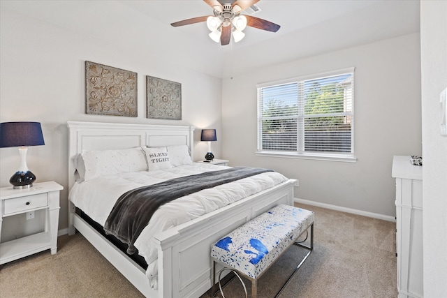 carpeted bedroom featuring ceiling fan and lofted ceiling