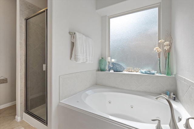 bathroom with tile patterned flooring and plus walk in shower