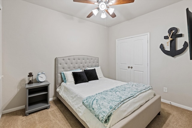 bedroom with light carpet and ceiling fan