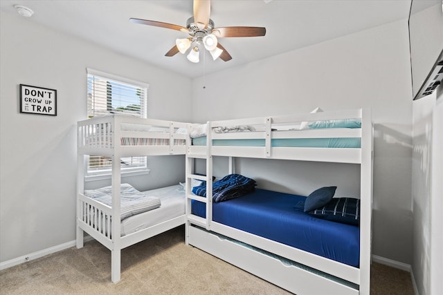 bedroom featuring ceiling fan and carpet floors