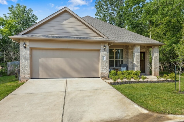 view of front of property with a garage, covered porch, and a front lawn