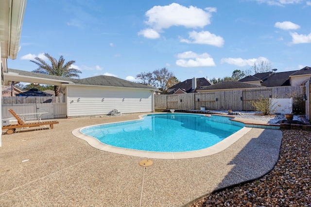 view of swimming pool with a patio