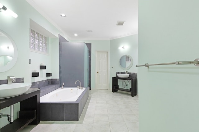 bathroom with tile patterned flooring, ornamental molding, separate shower and tub, and vanity