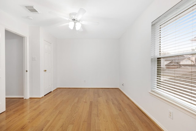 spare room with ceiling fan and light hardwood / wood-style floors