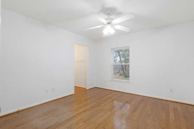 unfurnished room featuring light hardwood / wood-style flooring and ceiling fan