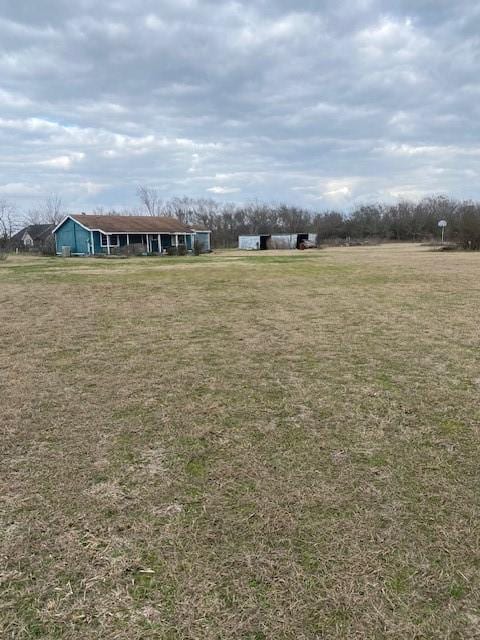 view of yard with a rural view