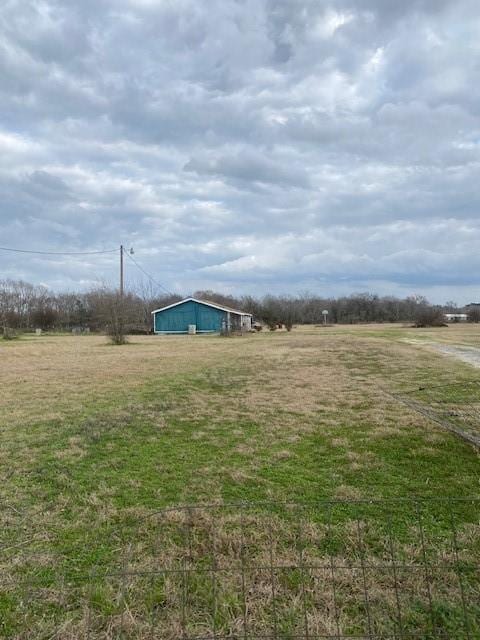 view of yard with a rural view