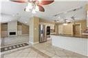 kitchen with ceiling fan and tile patterned flooring