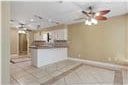 kitchen featuring ceiling fan and light tile patterned flooring