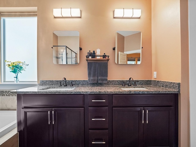 bathroom with vanity and separate shower and tub