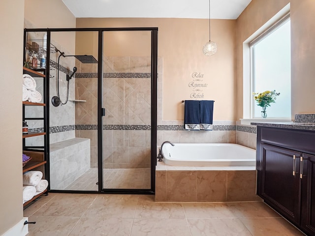 bathroom featuring vanity and shower with separate bathtub